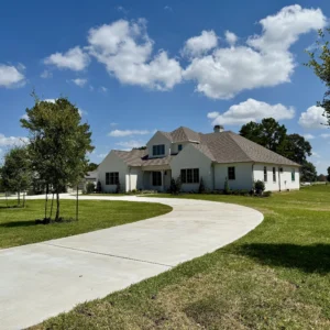 Jeff Paul custom home completed landscape curved driveway view