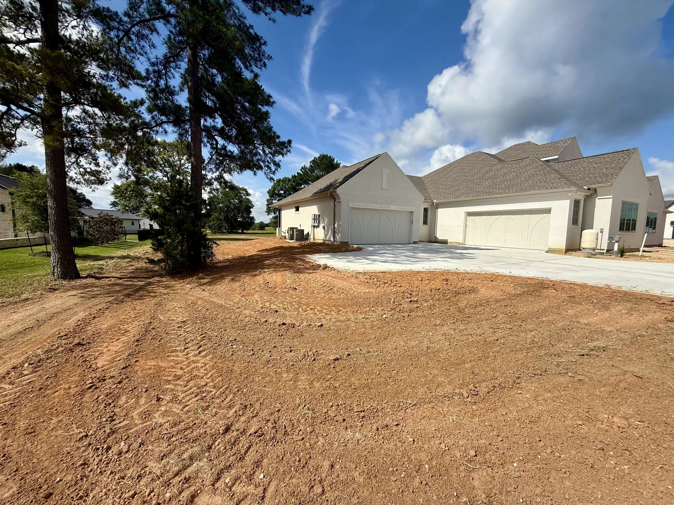 Jeff Paul custom home site before landscaping side view